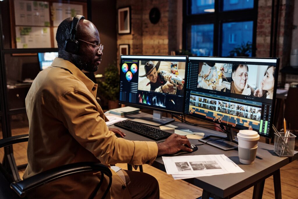 Man working in photo editor program on computer