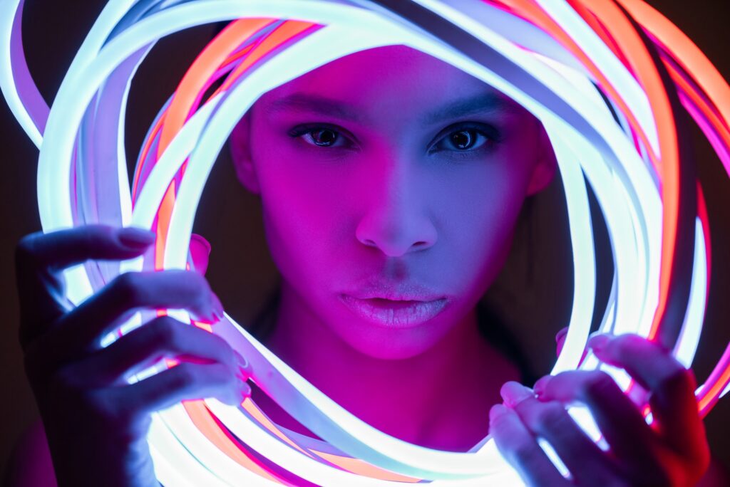 portrait of futuristic african american woman in neon lighting